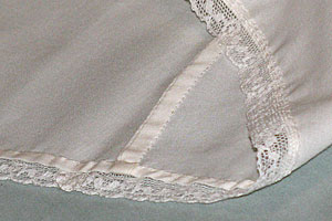Detail of a French seam on a Whispering Christening gown. Click image for larger view.